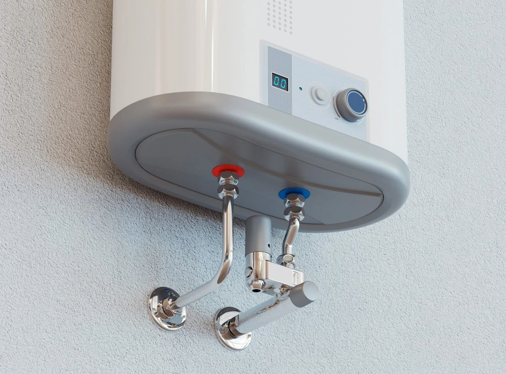 Technician installing a residential water heater in a Dubai apartment bathroom